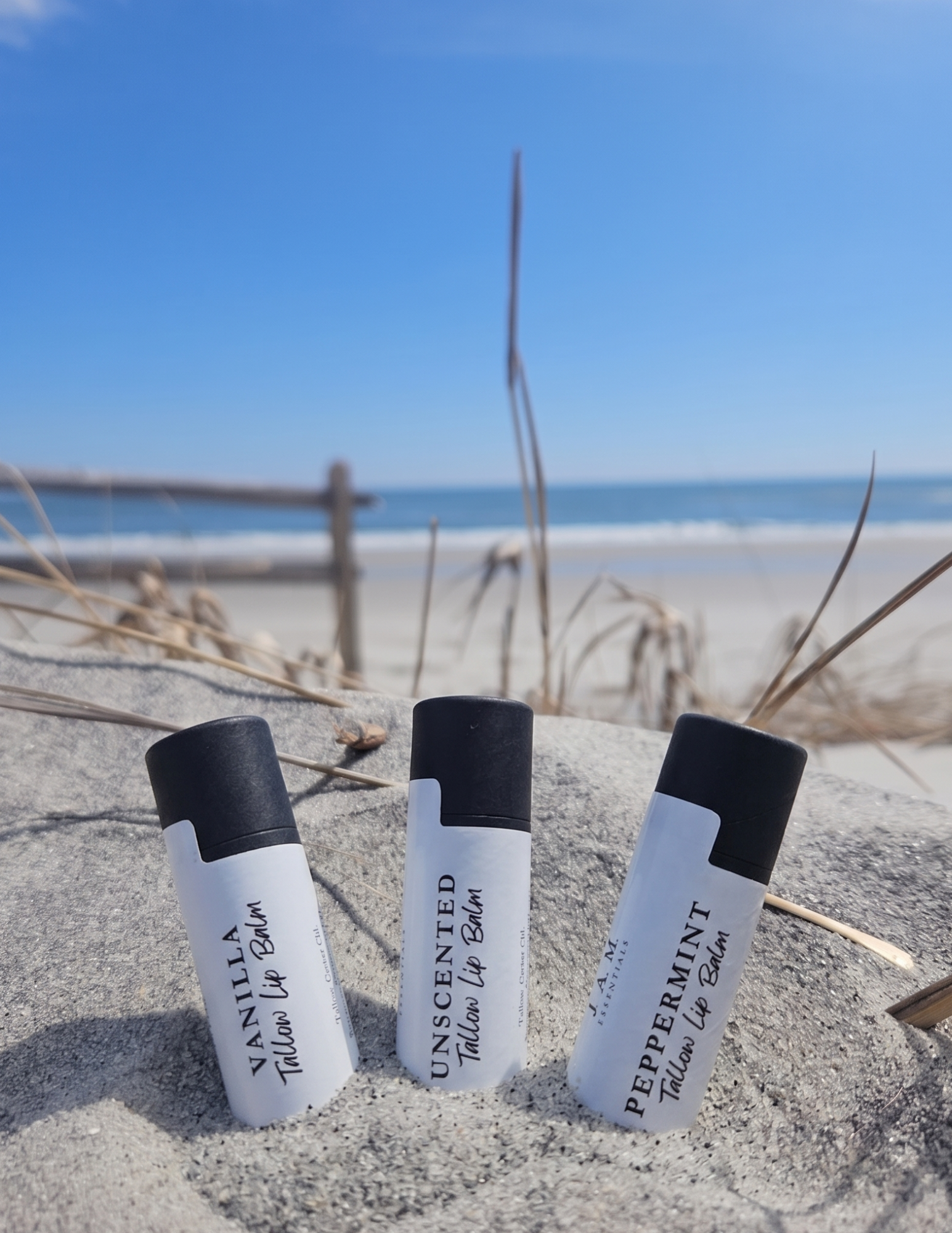 Small-batch handcrafted grass-fed tallow lip balm tube with castor oil and beeswax, coconut oil free for chronic dry chapped lips.