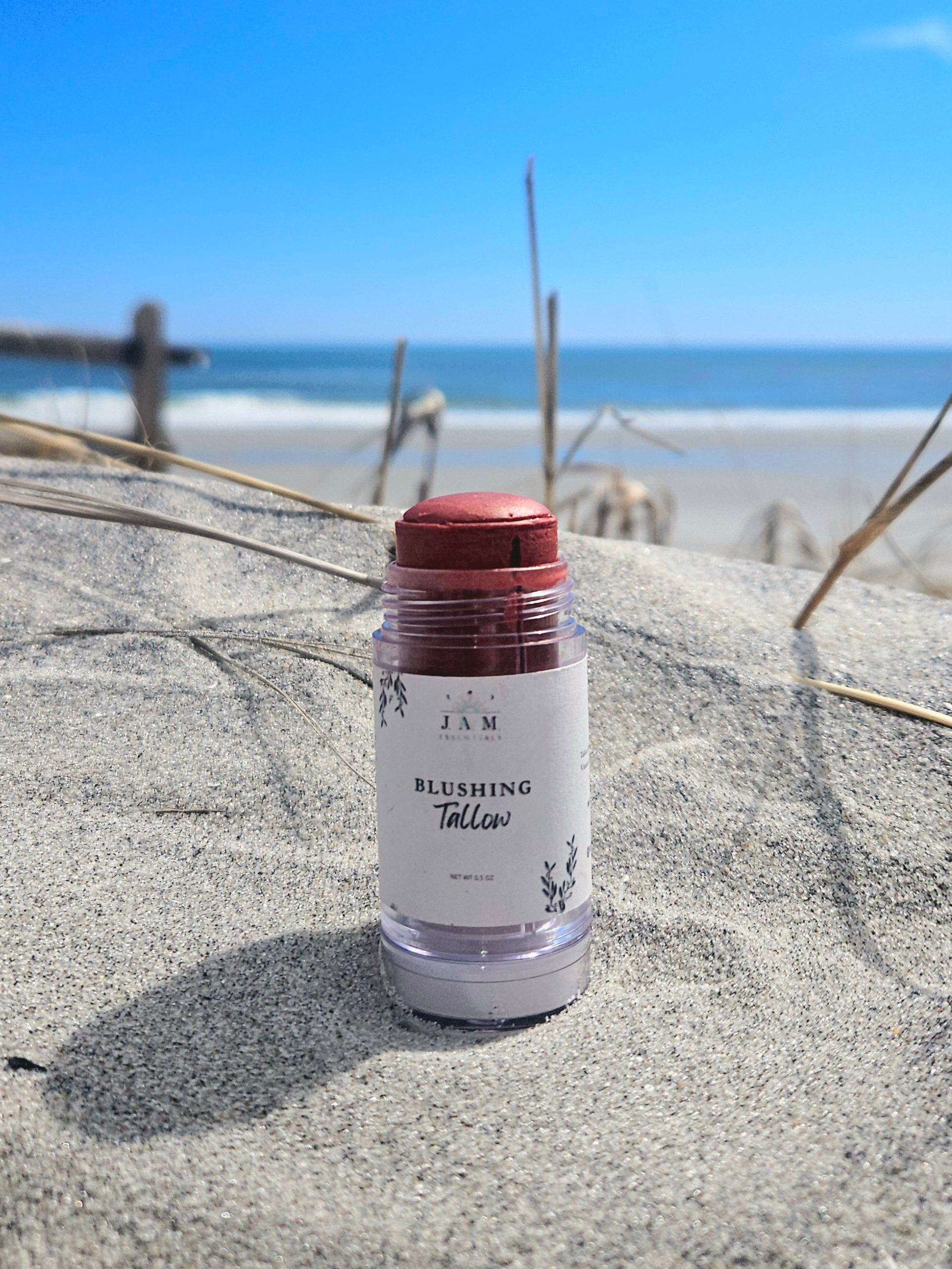 Small-batch handcrafted tinted tallow bronzer balm jar with  marula oil for a natural sun-kissed glow.