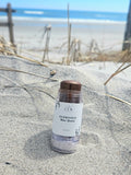 Small-batch handcrafted tinted tallow bronzer balm jar with  marula oil for a natural sun-kissed glow.