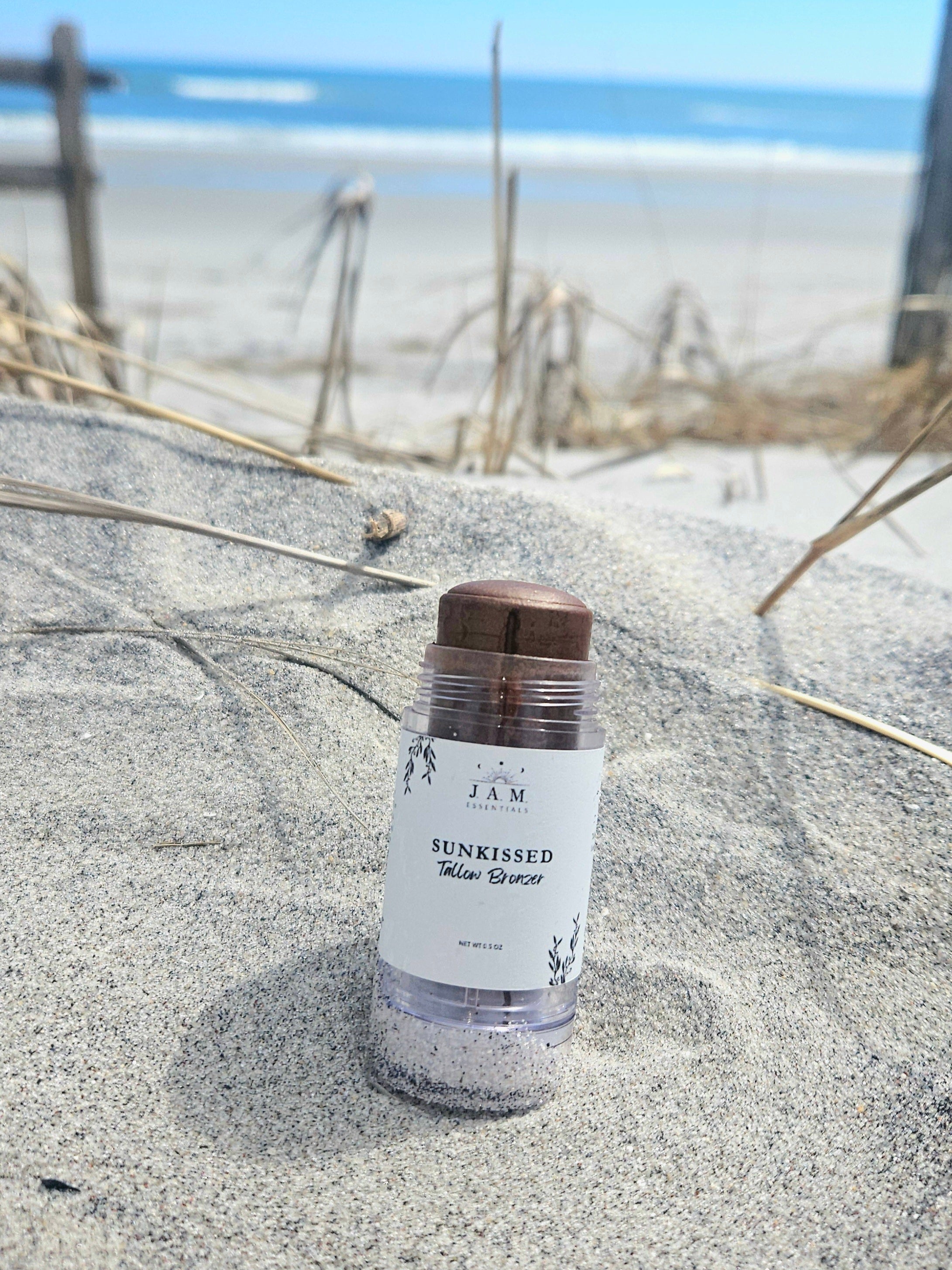 Small-batch handcrafted tinted tallow bronzer balm jar with  marula oil for a natural sun-kissed glow.